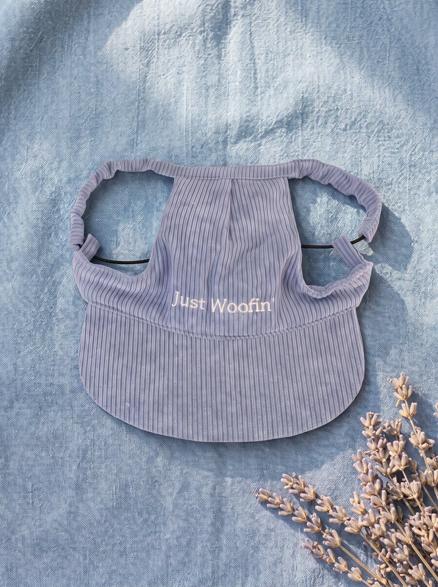 Just Woofin' blue corduroy dog hat with white embroidery on cream linen with eucalyptus