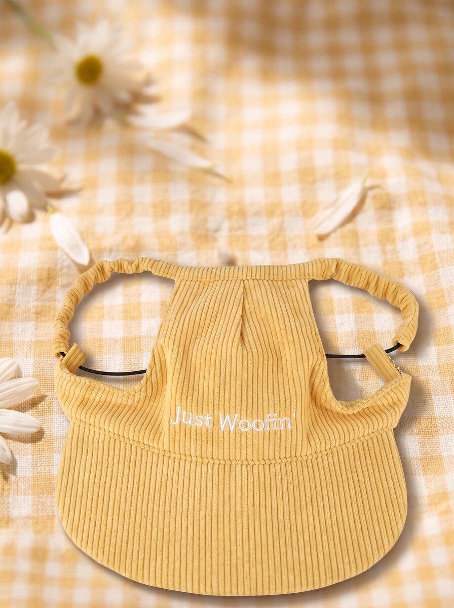 Just Woofin' yellow corduroy dog hat with white embroidery on cream linen with eucalyptus